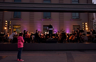 Pink little girl on classical concert 